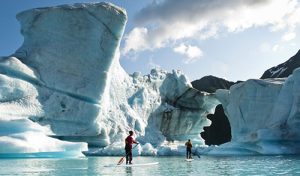 Stand Up Paddling in Bear Glacier Kenai Fjords Alaska.